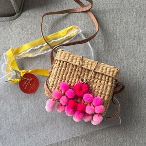 Chic Wicker Crossbody Bag with Pink Pom Poms